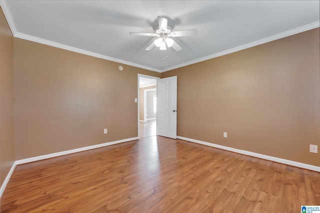 empty room with ceiling fan, light hardwood / wood-style floors, and ornamental molding