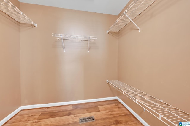 walk in closet featuring hardwood / wood-style floors