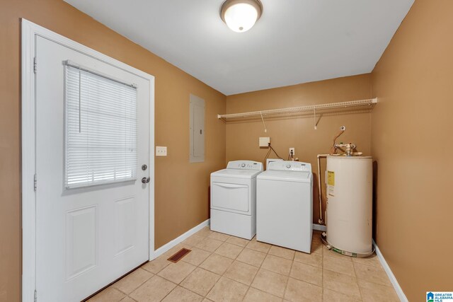 laundry area featuring separate washer and dryer, light tile patterned floors, water heater, and electric panel