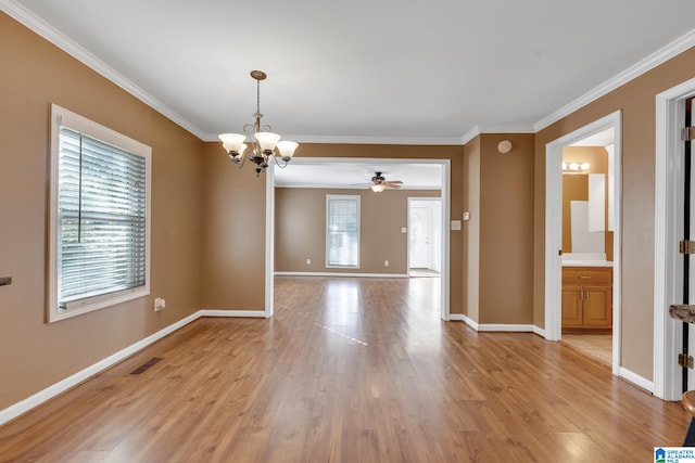 spare room featuring light wood-type flooring, ceiling fan with notable chandelier, and ornamental molding