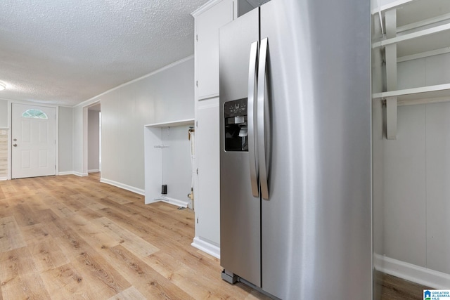 kitchen with crown molding, a textured ceiling, light hardwood / wood-style flooring, white cabinetry, and stainless steel fridge with ice dispenser