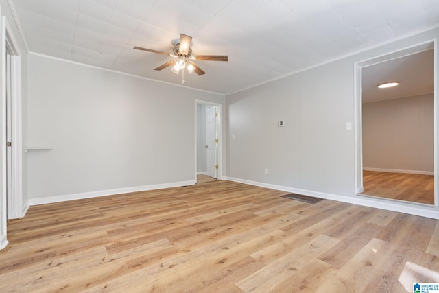 empty room featuring ceiling fan and light wood-type flooring