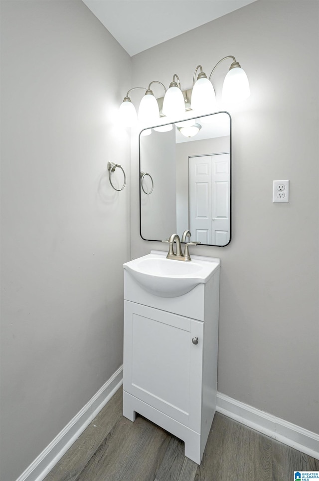 bathroom with vanity and wood-type flooring