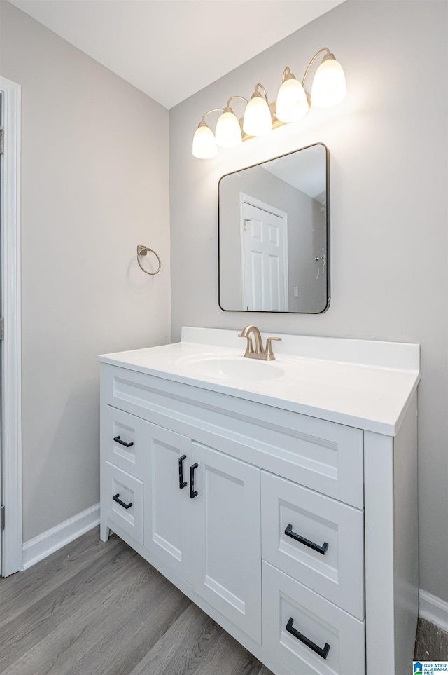 bathroom featuring hardwood / wood-style floors and vanity