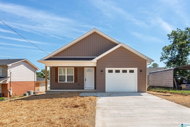 view of front of home featuring a garage, covered porch, board and batten siding, and driveway
