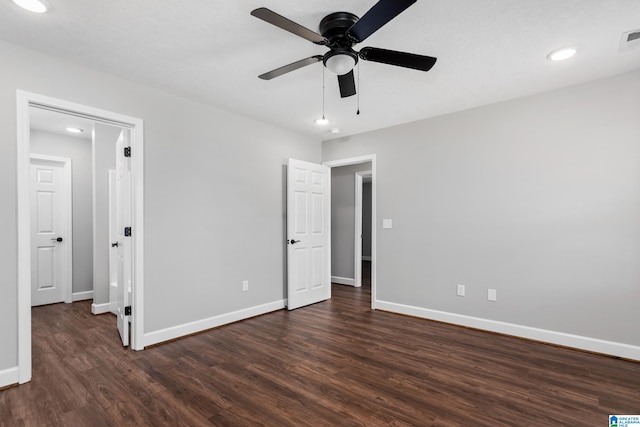 unfurnished bedroom with dark wood-type flooring and ceiling fan