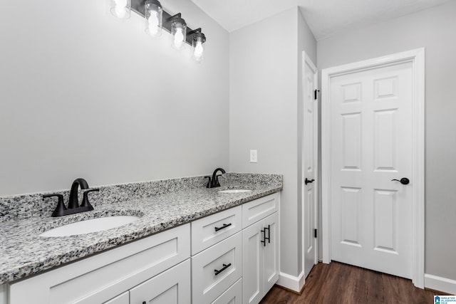 bathroom featuring vanity and hardwood / wood-style flooring