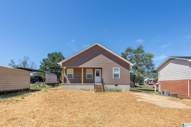 bungalow-style home featuring covered porch and central AC unit