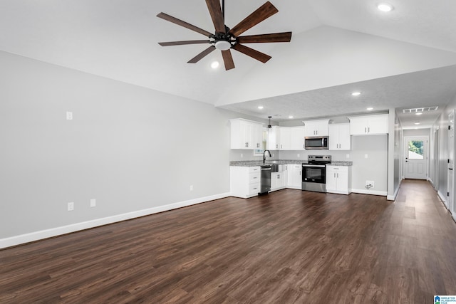 unfurnished living room featuring recessed lighting, a sink, baseboards, and ceiling fan