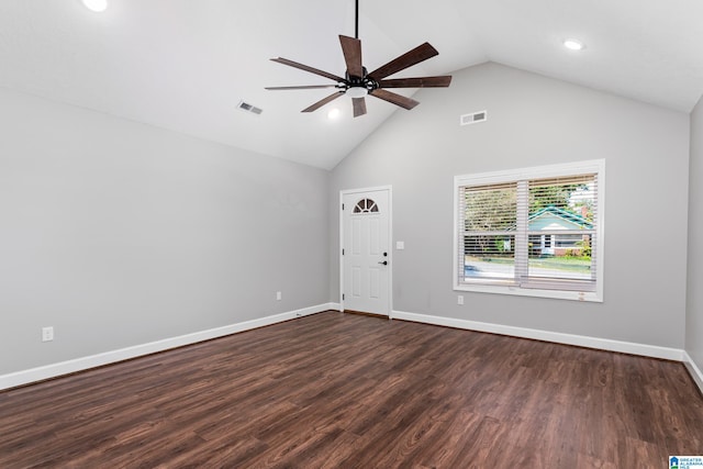 unfurnished room with dark wood-type flooring, ceiling fan, and high vaulted ceiling