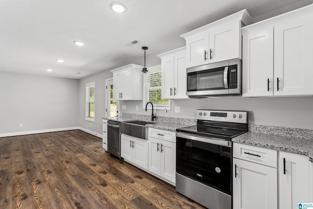 kitchen featuring sink, dark hardwood / wood-style floors, appliances with stainless steel finishes, and white cabinetry