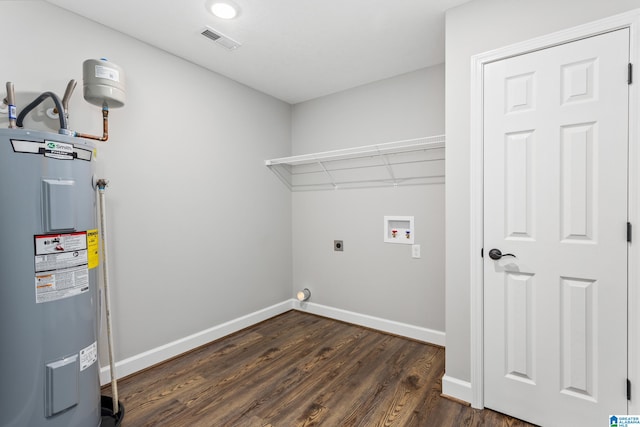 washroom with washer hookup, hookup for an electric dryer, dark hardwood / wood-style floors, and electric water heater