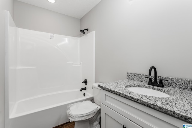 full bathroom featuring washtub / shower combination, toilet, and vanity