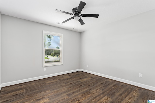 unfurnished room with ceiling fan and dark hardwood / wood-style floors