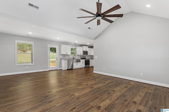 unfurnished living room with vaulted ceiling, dark hardwood / wood-style flooring, sink, and ceiling fan