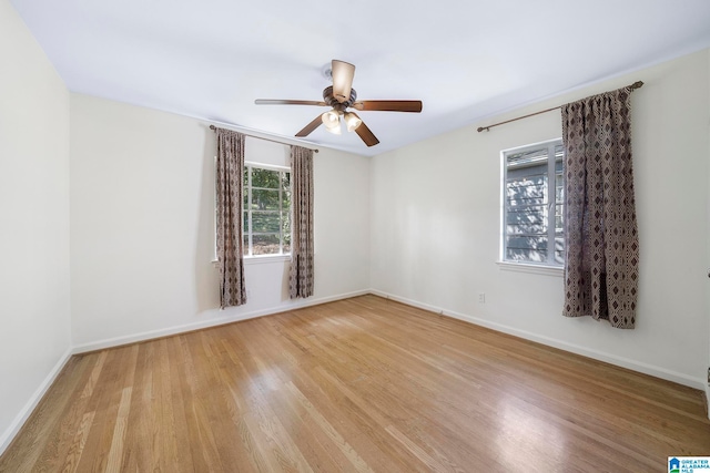 unfurnished room featuring light hardwood / wood-style flooring and ceiling fan