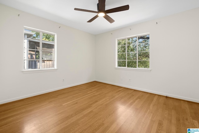 unfurnished room with ceiling fan and light hardwood / wood-style floors