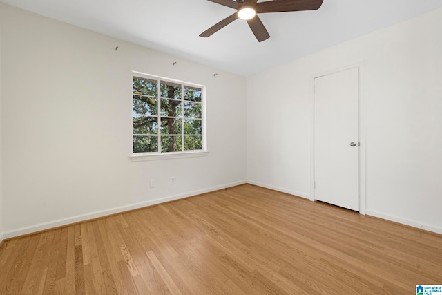 empty room featuring ceiling fan and light hardwood / wood-style floors