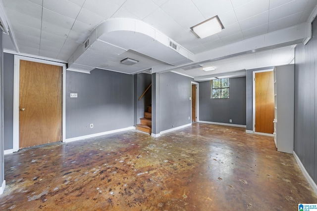 unfurnished room featuring concrete flooring