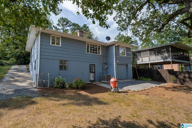 back of property with a garage