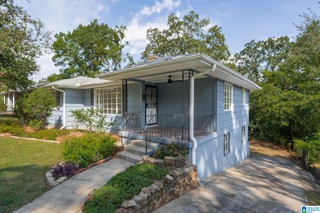 view of front of house featuring a front yard and covered porch