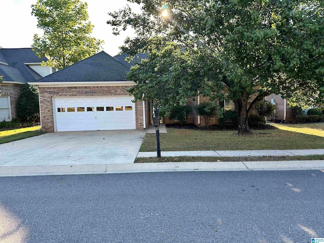 view of front of property with a garage and a front lawn