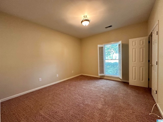 unfurnished room with carpet