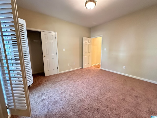 unfurnished bedroom with a closet and carpet