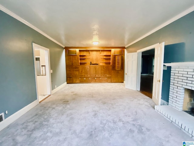 unfurnished living room featuring crown molding, a brick fireplace, and light colored carpet