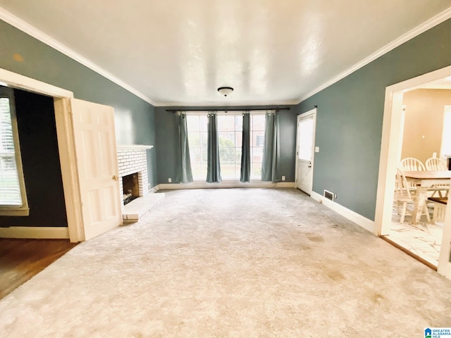 unfurnished living room featuring ornamental molding, a brick fireplace, and hardwood / wood-style flooring