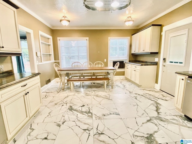 kitchen with ornamental molding, stainless steel dishwasher, and cream cabinets