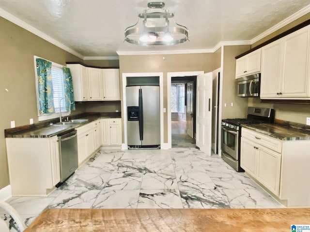 kitchen with stainless steel appliances, crown molding, and a healthy amount of sunlight