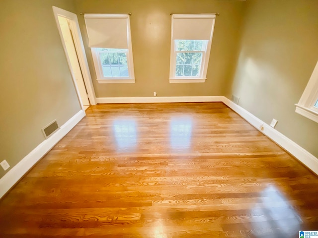 spare room with light hardwood / wood-style floors