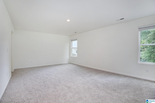 spare room with light carpet