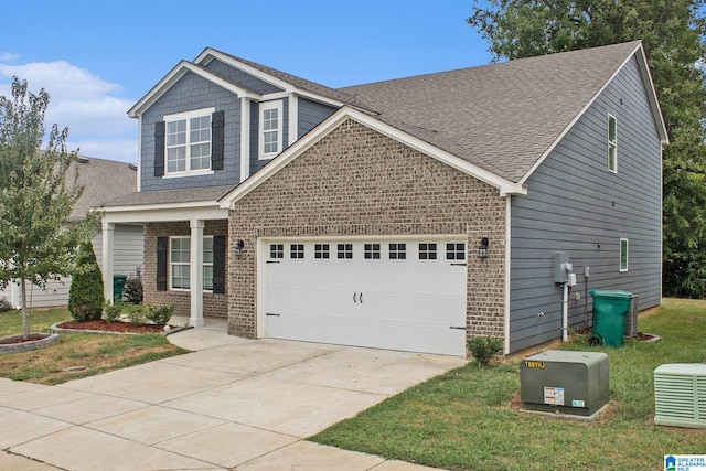 craftsman-style home with a garage and a front lawn