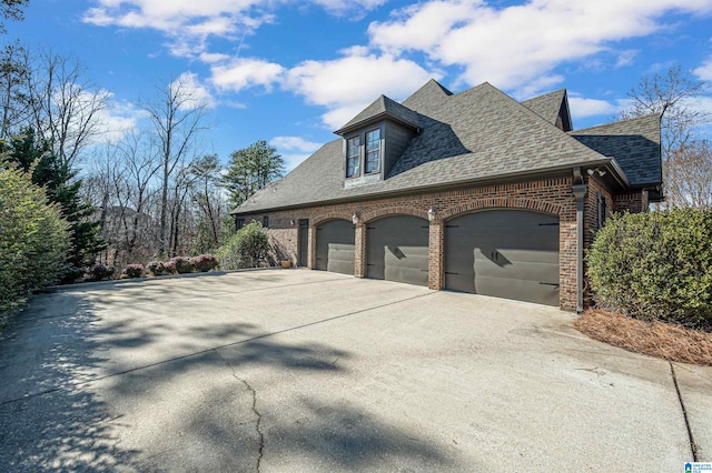 view of side of home featuring a garage