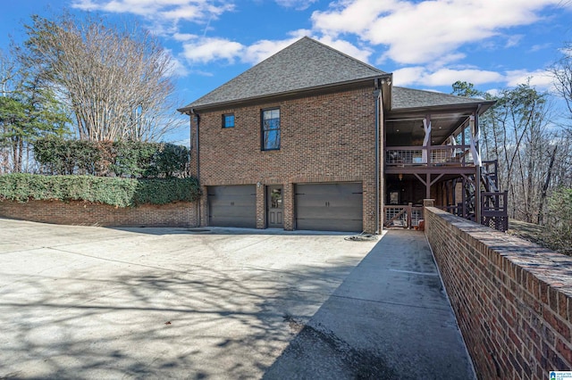 view of side of home with a garage