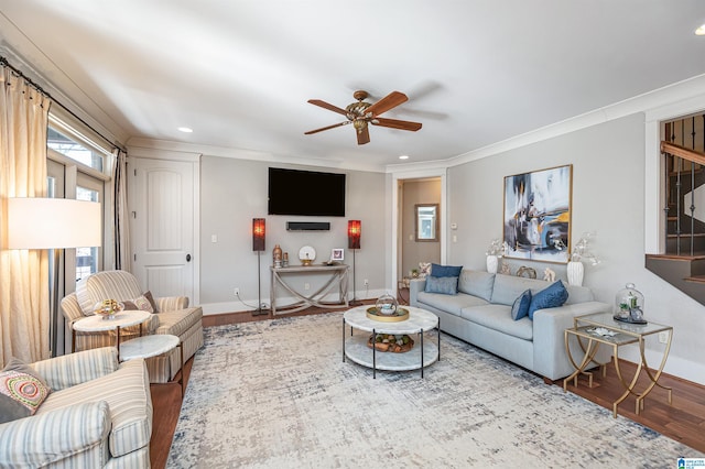 living room with ceiling fan, hardwood / wood-style flooring, and crown molding