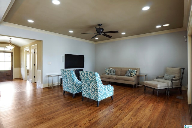 living room with ceiling fan, wood-type flooring, and ornamental molding