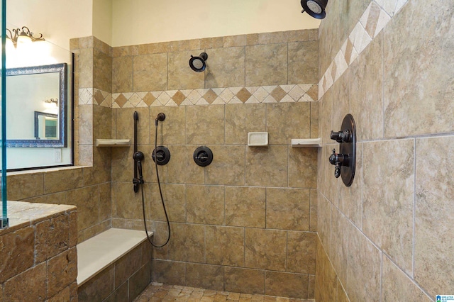 bathroom with tiled shower