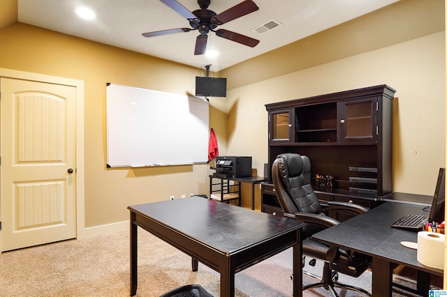 home office with light carpet and ceiling fan