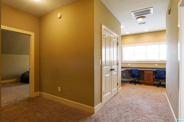 hallway featuring carpet