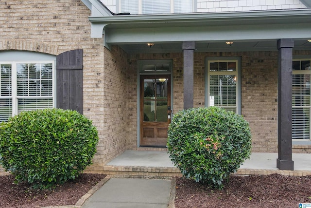 doorway to property featuring covered porch