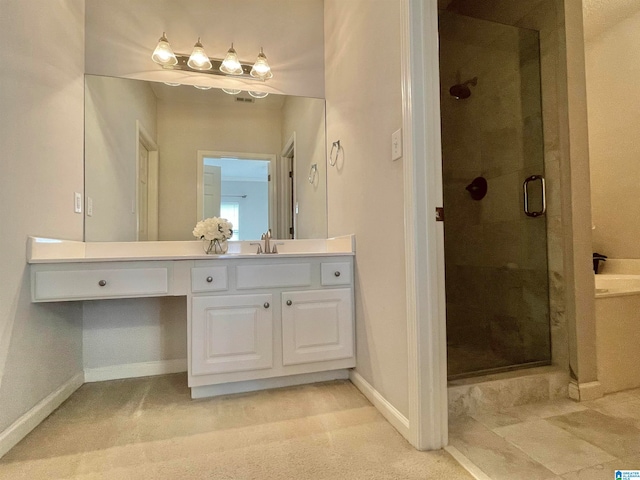 bathroom featuring vanity and a shower with shower door