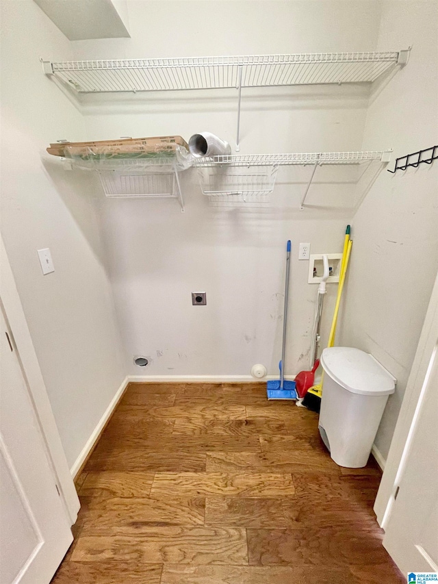 laundry room with electric dryer hookup, washer hookup, and hardwood / wood-style flooring