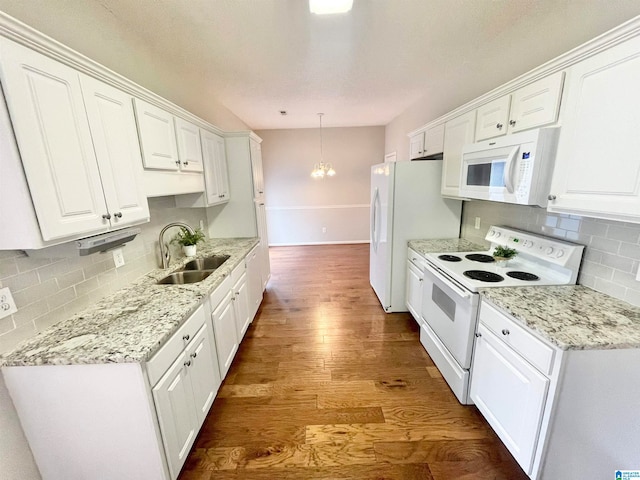 kitchen featuring wood-type flooring, sink, white appliances, and white cabinetry