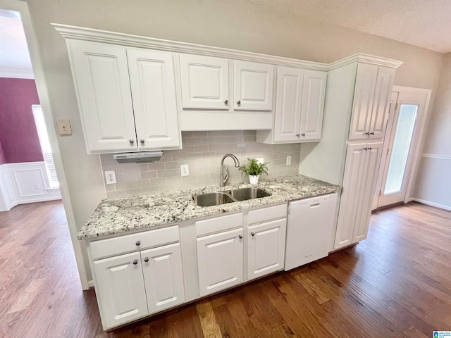 kitchen featuring dishwasher, dark hardwood / wood-style flooring, sink, and white cabinets