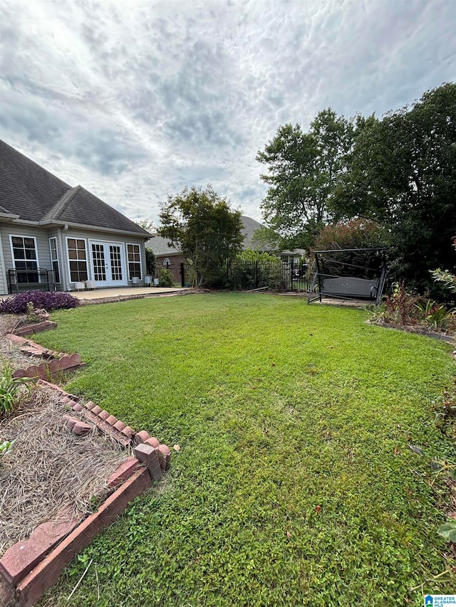 view of yard with french doors