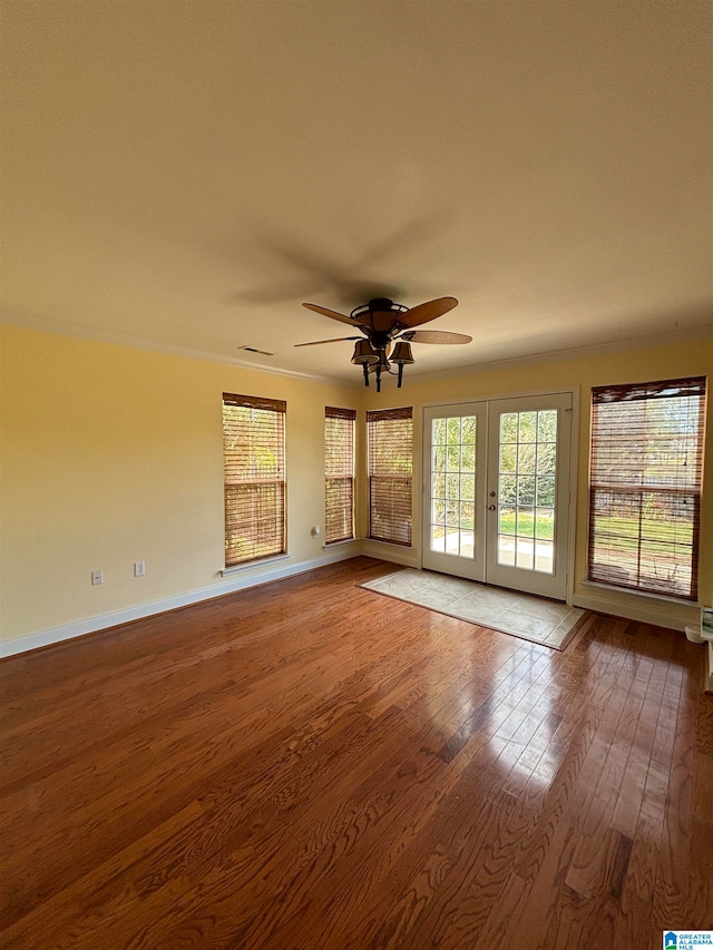 unfurnished living room with ceiling fan and hardwood / wood-style floors