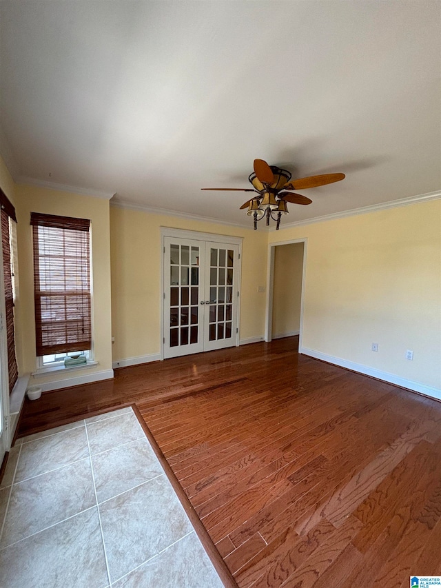 interior space featuring crown molding, french doors, ceiling fan, and hardwood / wood-style flooring